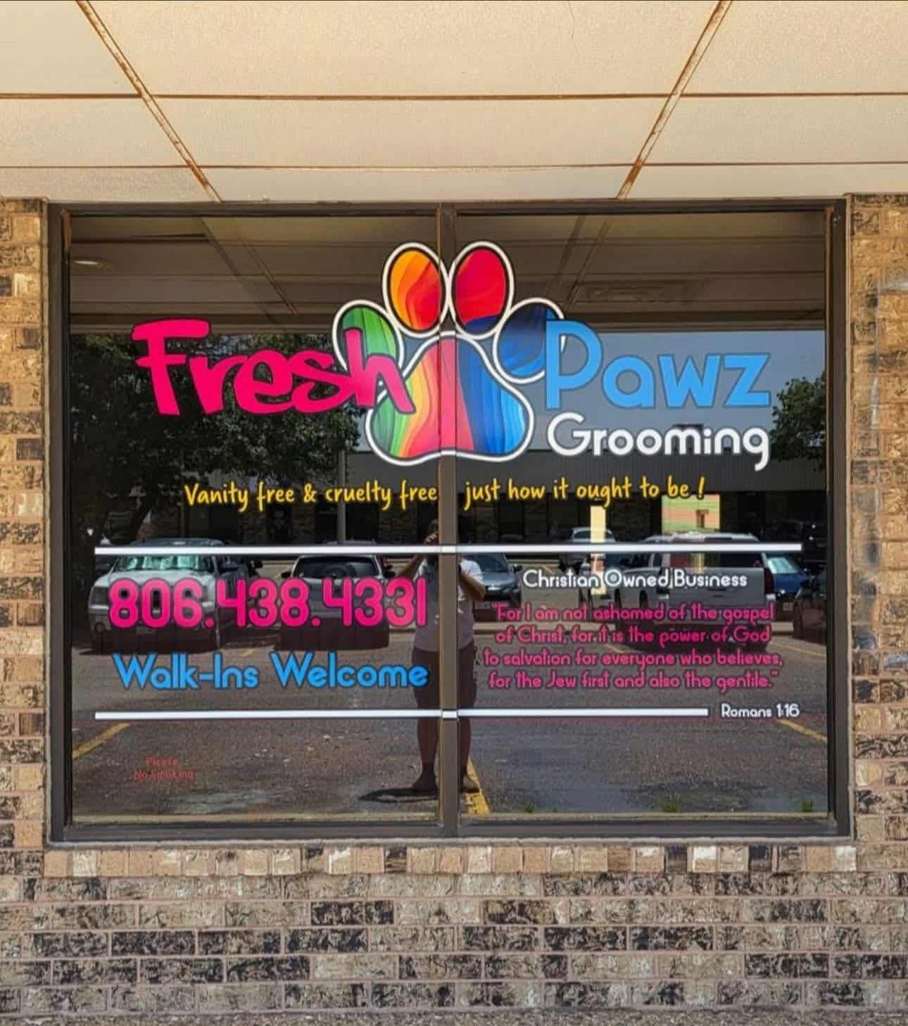 Fresh Pawz Grooming storefront with colorful paw branding